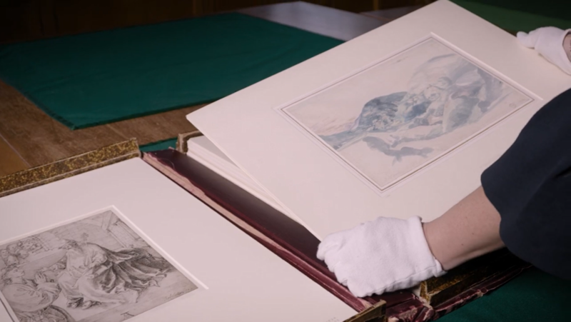 A curator handles artworks in the Ashmolean's Western Art Print Room